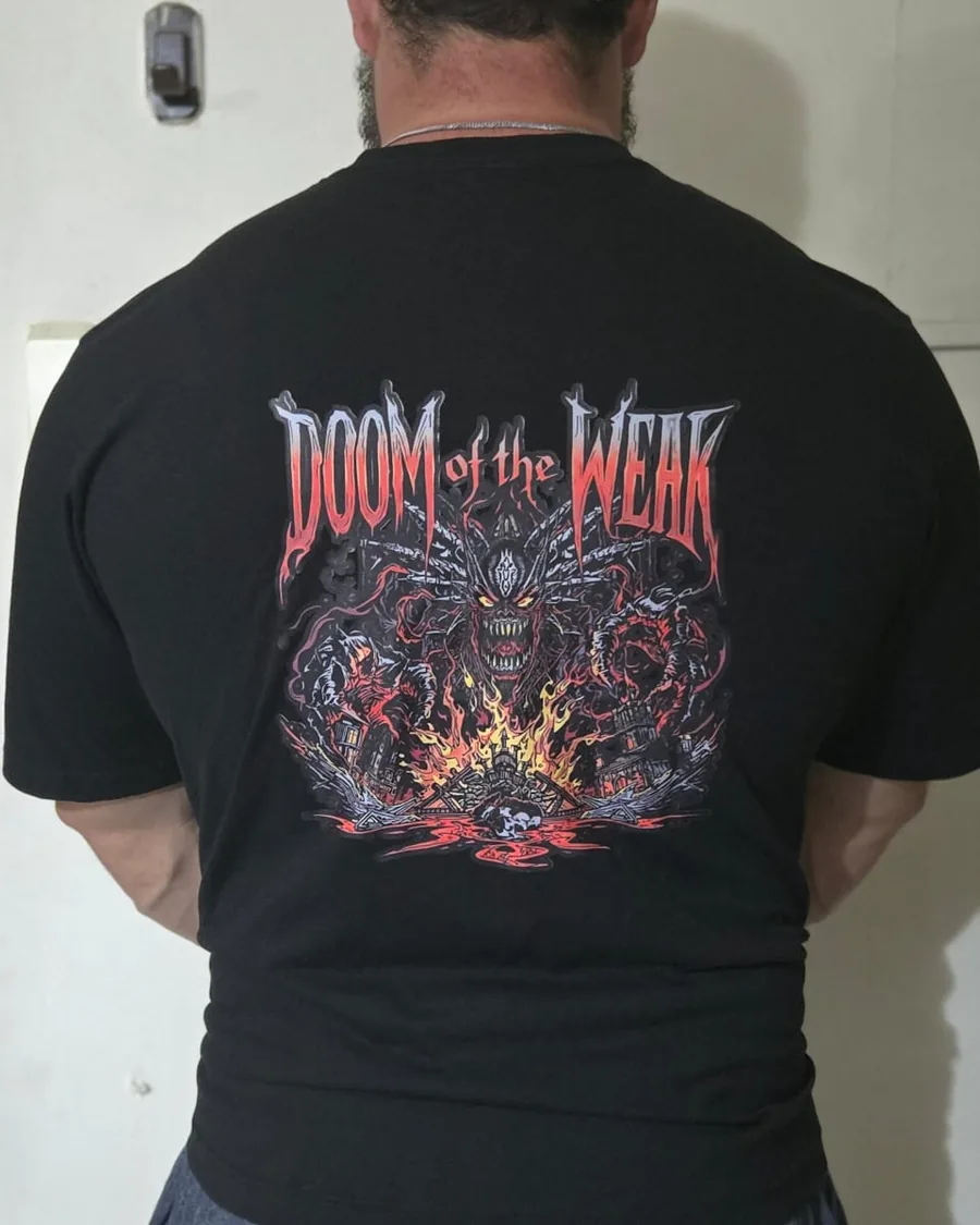 Douglas Lutz wearing the black Doom of the Weak t-shirt, back print