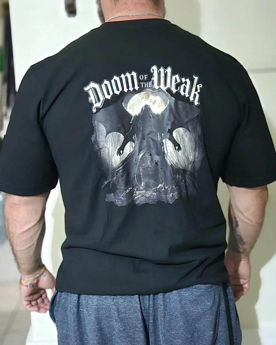 Douglas Lutz wearing the black Doom of the Weak gothic t-shirt, back print