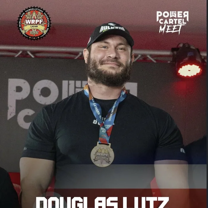 Douglas Lutz on the podium with the WRPF gold medal
